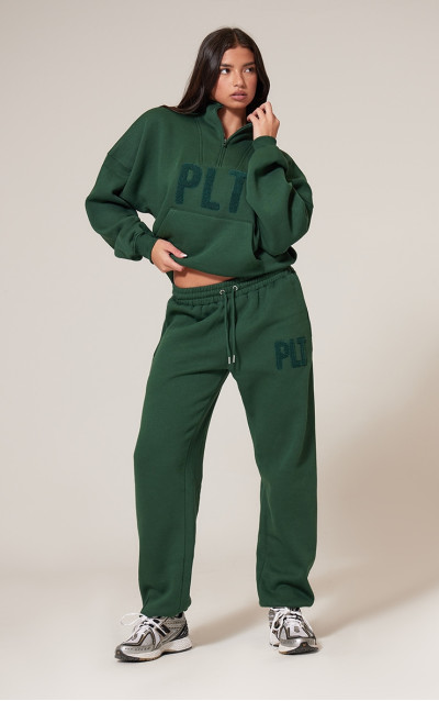 Брюки для бігу з манжетами PRETTYLITTLETHING Forest Green Borg Applique