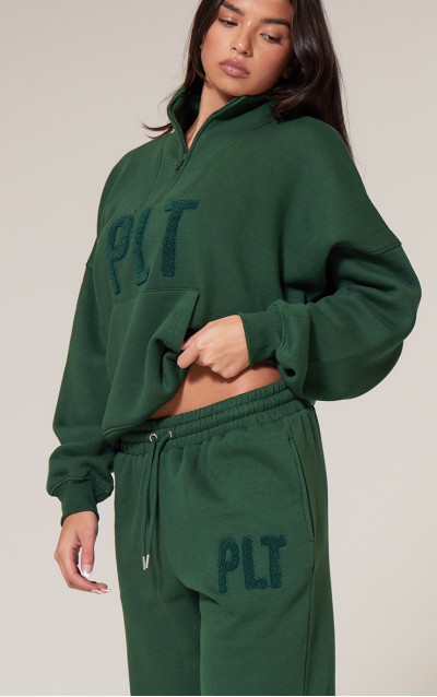 Брюки для бігу з манжетами PRETTYLITTLETHING Forest Green Borg Applique