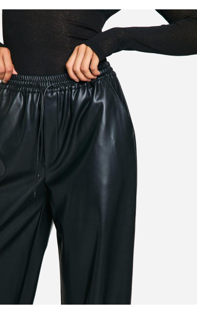Високі широкі штани зі штучної шкіри на шнурках